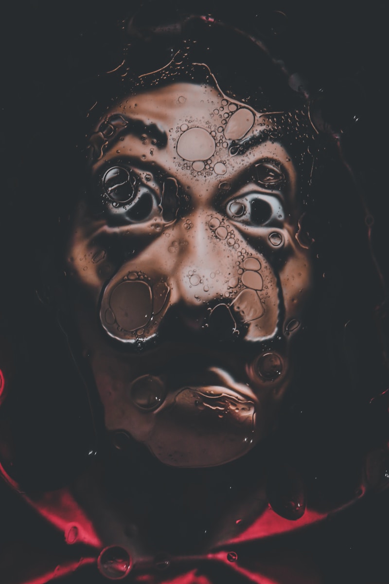 a person with a creepy face in the dark