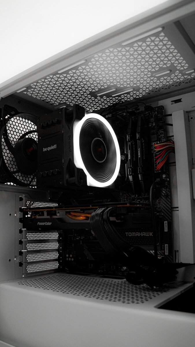 A close up of a computer case with a fan
