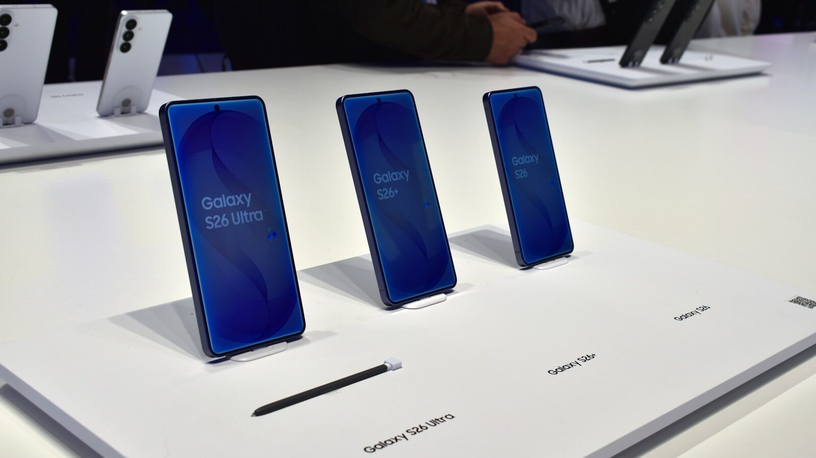Three samsung galaxy smartphones displayed on a white surface.